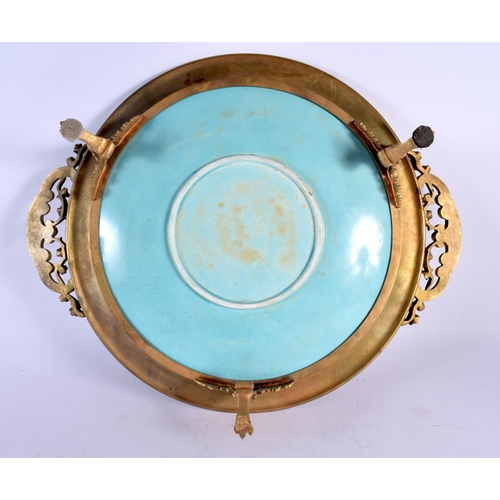 462 - A FINE 19TH CENTURY TWIN HANDLED FRENCH GILT BRONZE POTTERY DISH painted with birds. 48 cm wide.