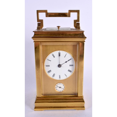 469 - AN ANTIQUE FRENCH REPEATING BRASS CARRIAGE CLOCK with twin dials. 17 cm high inc handle.