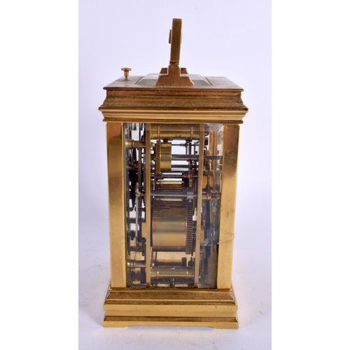 469 - AN ANTIQUE FRENCH REPEATING BRASS CARRIAGE CLOCK with twin dials. 17 cm high inc handle.