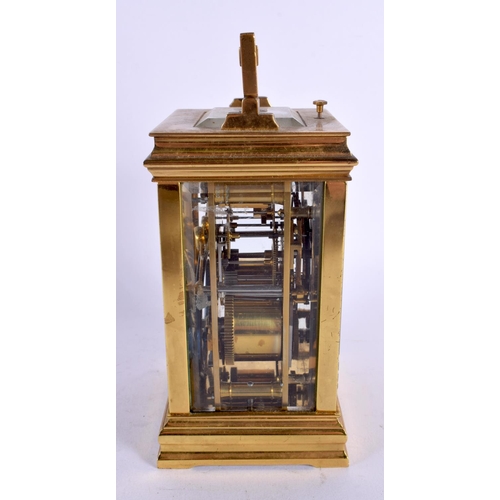 469 - AN ANTIQUE FRENCH REPEATING BRASS CARRIAGE CLOCK with twin dials. 17 cm high inc handle.