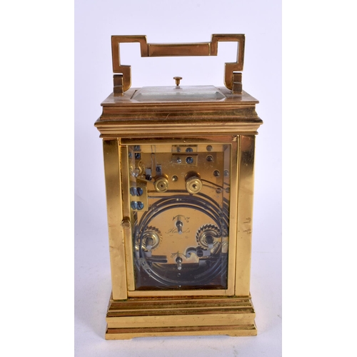 469 - AN ANTIQUE FRENCH REPEATING BRASS CARRIAGE CLOCK with twin dials. 17 cm high inc handle.