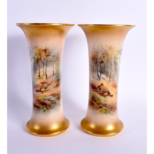 47 - A PAIR OF ROYAL WORCESTER PORCELAIN VASES by James Stinton. 19 cm high.