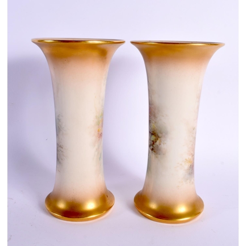 47 - A PAIR OF ROYAL WORCESTER PORCELAIN VASES by James Stinton. 19 cm high.