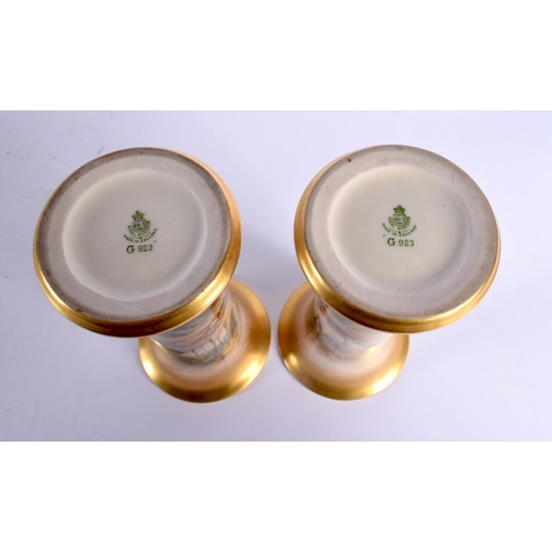 47 - A PAIR OF ROYAL WORCESTER PORCELAIN VASES by James Stinton. 19 cm high.