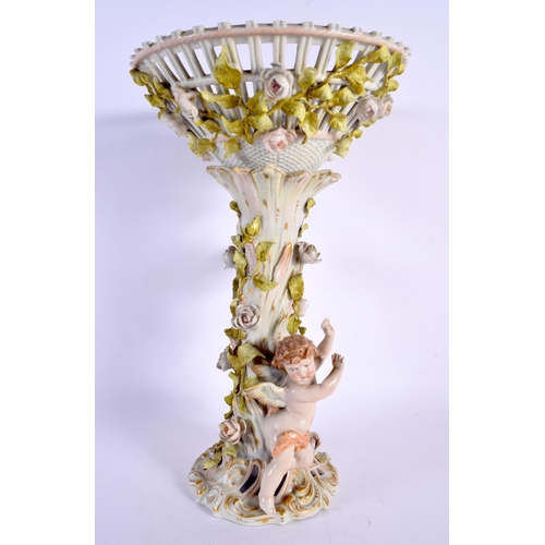 48 - A LARGE GERMAN PORCELAIN COMPORT overlaid with putti. 35 cm x 15 cm.