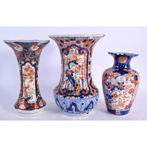 482 - THREE 19TH CENTURY JAPANESE MEIJI PERIOD IMARI VASES. Largest 23 cm high. (3)