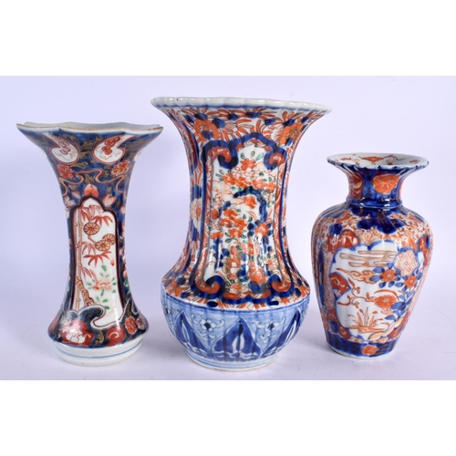 482 - THREE 19TH CENTURY JAPANESE MEIJI PERIOD IMARI VASES. Largest 23 cm high. (3)