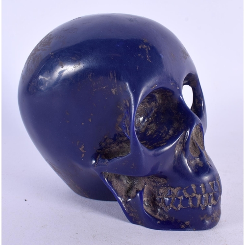 486 - A CONTEMPORY CARVED LAPIS LAZULI TYPE SKULL. 12 cm x 10 cm.