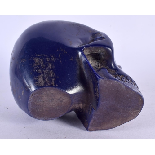 486 - A CONTEMPORY CARVED LAPIS LAZULI TYPE SKULL. 12 cm x 10 cm.