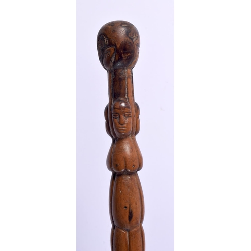 496 - AN ANTIQUE CONTINENTAL FOLK ART CARVED WOOD TRIBAL WALKING STAFF decorated with snakes and females. ... 