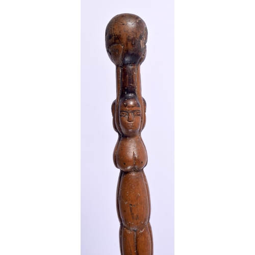 496 - AN ANTIQUE CONTINENTAL FOLK ART CARVED WOOD TRIBAL WALKING STAFF decorated with snakes and females. ... 