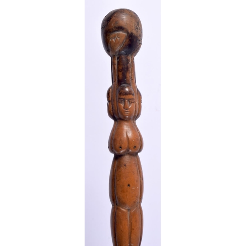 496 - AN ANTIQUE CONTINENTAL FOLK ART CARVED WOOD TRIBAL WALKING STAFF decorated with snakes and females. ... 