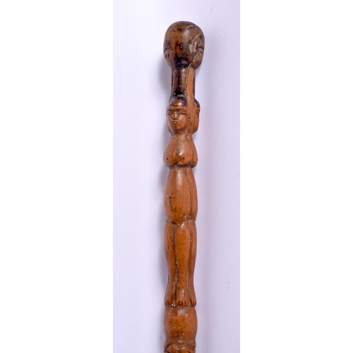 496 - AN ANTIQUE CONTINENTAL FOLK ART CARVED WOOD TRIBAL WALKING STAFF decorated with snakes and females. ... 