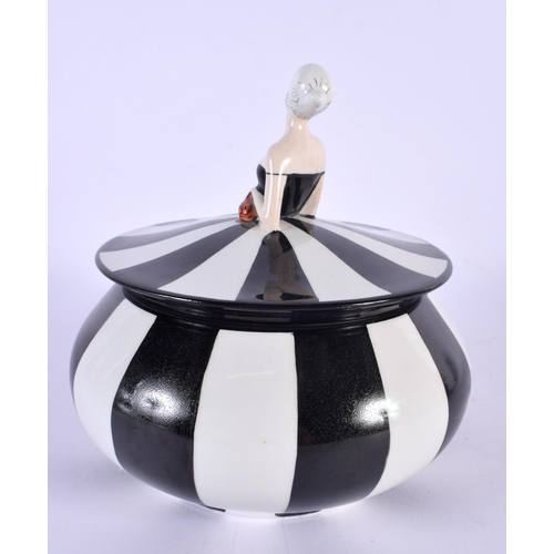 4 - A RARE ART DECO CARLTONWARE POWDER BOX AND COVER formed as a female wearing a black and white dress.... 