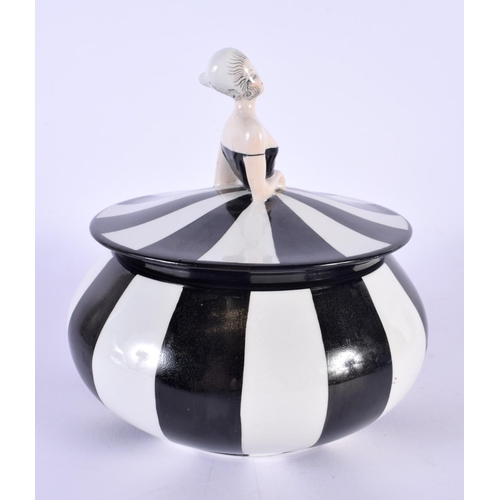 4 - A RARE ART DECO CARLTONWARE POWDER BOX AND COVER formed as a female wearing a black and white dress.... 