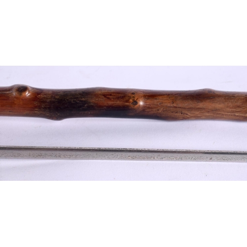 516 - AN ANTIQUE SWORD STICK. 82 cm long.