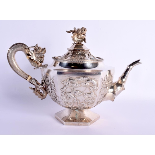 537 - A FINE 19TH CENTURY CHINESE EXPORT SILVER TEASET by Wang Hing, decorated with prunus and leaves and ... 