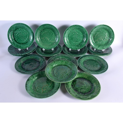 54 - A SET OF EIGHTEEN ANTIQUE GREEN GLAZED MAJOLICA CABBAGE LEAF DISHES. 22 cm diameter. (18)