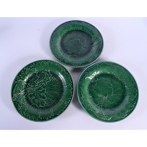 54 - A SET OF EIGHTEEN ANTIQUE GREEN GLAZED MAJOLICA CABBAGE LEAF DISHES. 22 cm diameter. (18)