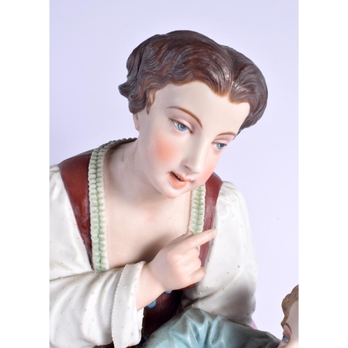 55 - A HUGE PAIR OF 19TH CENTURY FRENCH BISQUE PORCELAIN FIGURES modelled with children. 46 cm x 14 cm.