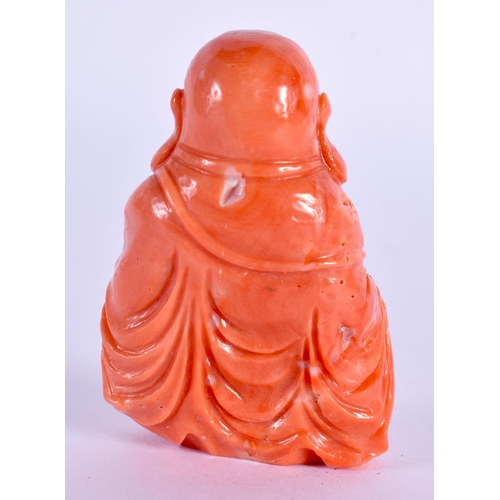 555 - A SMALL 19TH CENTURY CHINESE CARVED RED CORAL FIGURE OF A BUDDHA Qing. 42 grams. 5 cm x 3.5 cm.