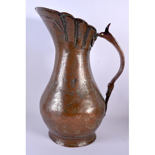 563 - A LARGE ANTIQUE MIDDLE EASTERN PERSIAN COPPER ALLOY JUG decorated with floral motifs together with a... 