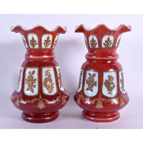 575 - A PAIR OF ANTIQUE BOHEMIAN GLASS VASES. 12 cm high.