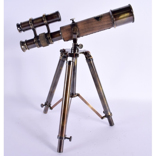 592 - A CONTEMPORARY LEATHER WRAPPED TELESCOPE. 31 cm x 25 cm.