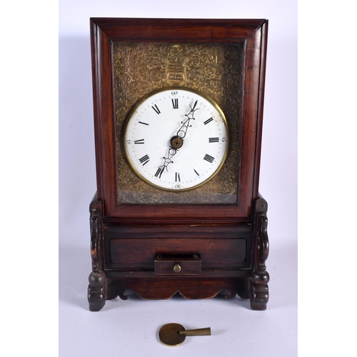 605 - A MID 19TH CENTURY CHINESE HONGMU MANTEL CLOCK with repousse gilt metal encased dial. 36 cm x 20 cm.