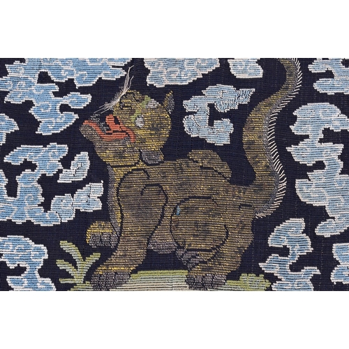 619 - A FINE PAIR OF 18TH CENTURY CHINESE KESI SILK BADGES depicting scowling cats amongst clouds and cora... 