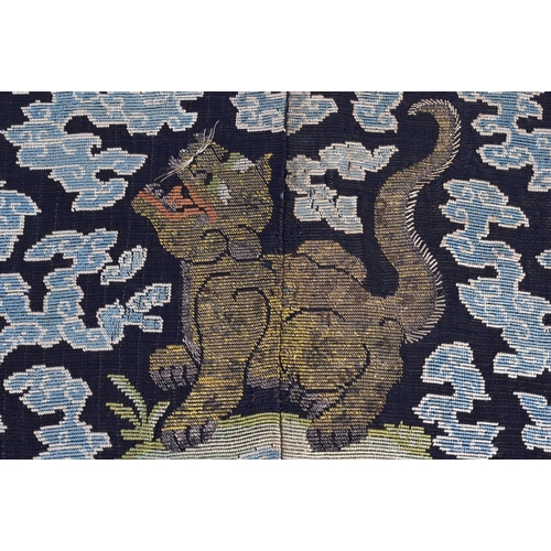 619 - A FINE PAIR OF 18TH CENTURY CHINESE KESI SILK BADGES depicting scowling cats amongst clouds and cora... 