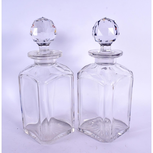 62 - A PAIR OF ANTIQUE WHISKEY GLASS DECANTERS. 26 cm high.