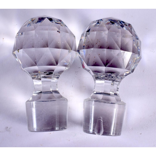 62 - A PAIR OF ANTIQUE WHISKEY GLASS DECANTERS. 26 cm high.