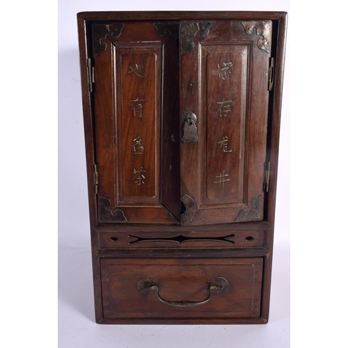 626 - AN UNUSUAL 19TH CENTURY CHINESE CARVED HARDWOOD CABINET Qing, together with a Ming green glazed teap... 