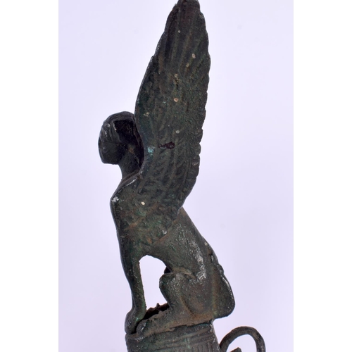 633 - A 19TH CENTURY EUROPEAN GRAND TOUR BRONZE SPHINX STAND After the Antiquity, possibly an oil lamp bas... 