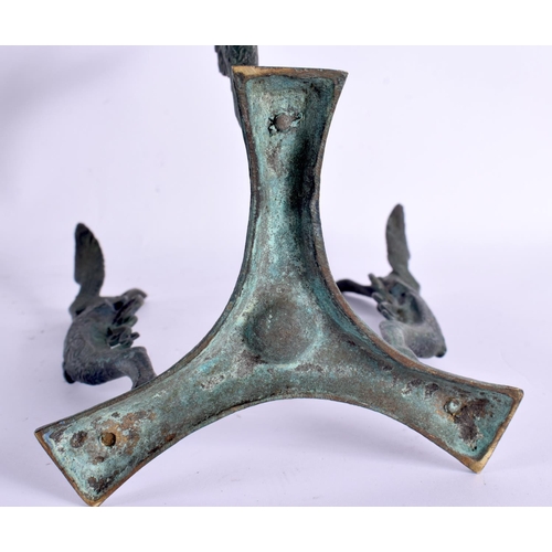 633 - A 19TH CENTURY EUROPEAN GRAND TOUR BRONZE SPHINX STAND After the Antiquity, possibly an oil lamp bas... 