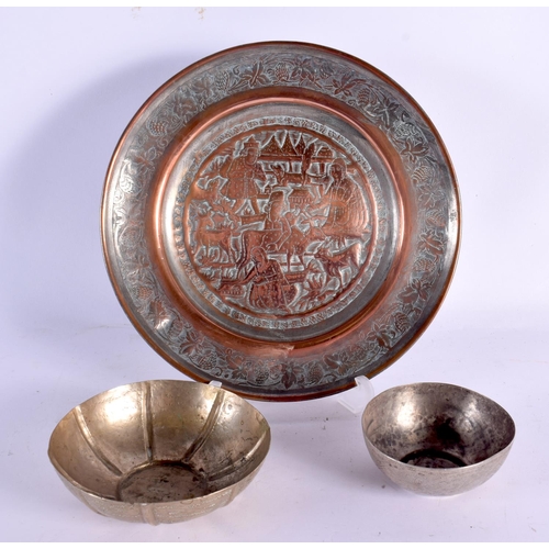 634 - TWO VINTAGE CONTINENTAL WHITE METAL BOWLS together with an Islamic dish. Largest 18 cm wide. (3)