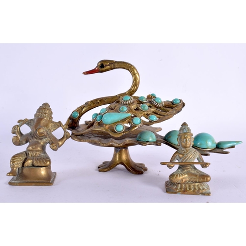 635 - TWO ANTIQUE MINIATURE INDIAN BRONZE DEITIES together with a turquoise inset swan. Largest 14 cm x 7 ... 