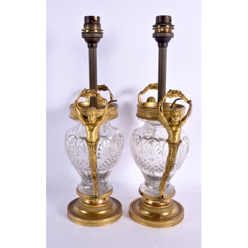 642 - A PAIR OF 19TH CENTURY FRENCH GILT BRONZE AND CRYSTAL GLASS LAMPS with figural mounts. 32 cm x 15 cm... 