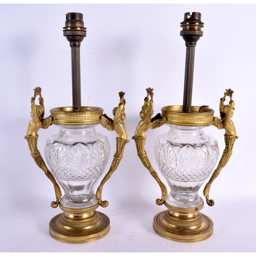 642 - A PAIR OF 19TH CENTURY FRENCH GILT BRONZE AND CRYSTAL GLASS LAMPS with figural mounts. 32 cm x 15 cm... 