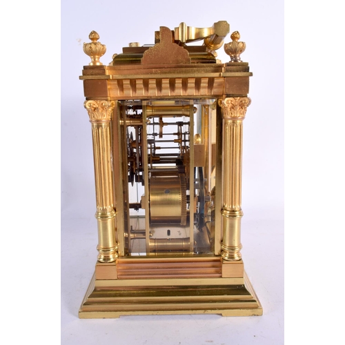 644 - A LARGE FRENCH ANTIQUE BRONZE REPEATING CARRIAGE CLOCK with enamel dial. 20 cm high inc handle.