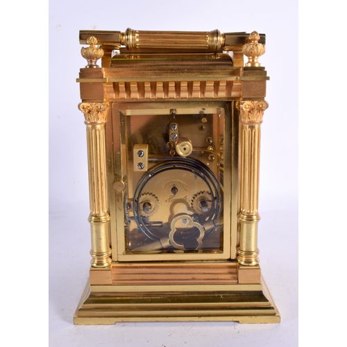 644 - A LARGE FRENCH ANTIQUE BRONZE REPEATING CARRIAGE CLOCK with enamel dial. 20 cm high inc handle.