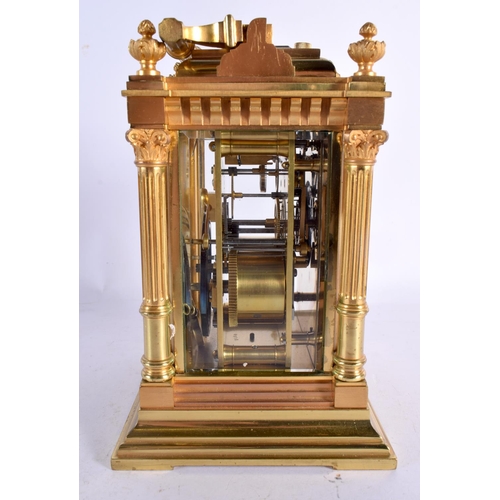 644 - A LARGE FRENCH ANTIQUE BRONZE REPEATING CARRIAGE CLOCK with enamel dial. 20 cm high inc handle.