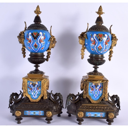 650 - A LARGE 19TH CENTURY FRENCH BRONZE AND PORCELAIN CLOCK GARNITURE painted with motifs. Mantel 42 cm x... 