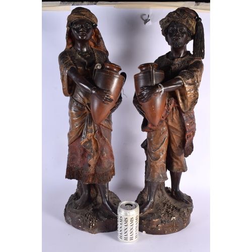 651 - A LARGE PAIR OF 19TH CENTURY AUSTRIAN COLD PAINTED TERRACOTTA FIGURES modelled holding an amphora. 6... 