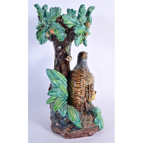 658 - A 19TH CENTURY MAJOLICA GERMAN HUGO LONITZ POTTERY STAND formed as three birds under foliage. 34 cm ... 