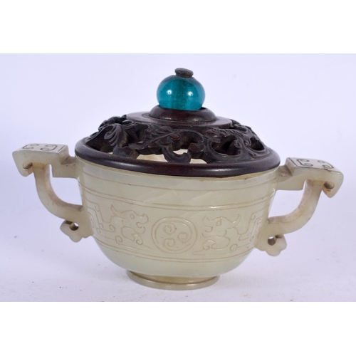 672 - AN 18TH CENTURY CHINESE TWIN HANDLED CARVED JADE LIBATION CUP with hardwood and stone finial. 12 cm ... 