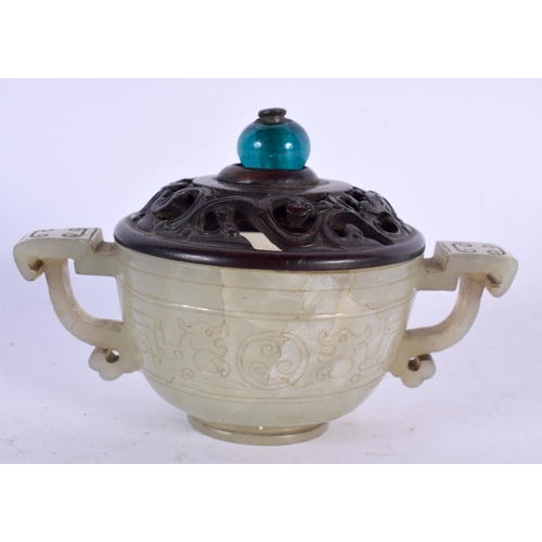 672 - AN 18TH CENTURY CHINESE TWIN HANDLED CARVED JADE LIBATION CUP with hardwood and stone finial. 12 cm ... 