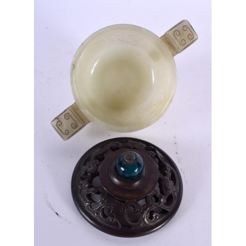 672 - AN 18TH CENTURY CHINESE TWIN HANDLED CARVED JADE LIBATION CUP with hardwood and stone finial. 12 cm ... 