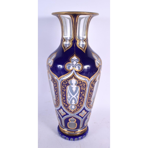 675 - A LARGE ANTIQUE BOHEMIAN BLUE AND GILT GLASS ISLAMIC TYPE VASE. 40 cm x 18 cm.